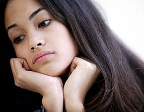 young woman wondering ig she can get an abortion without telling her parents