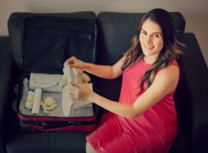 Pretty Latin pregnant woman packing her labor bag at home