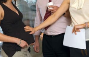woman touching pregnant belly personal space