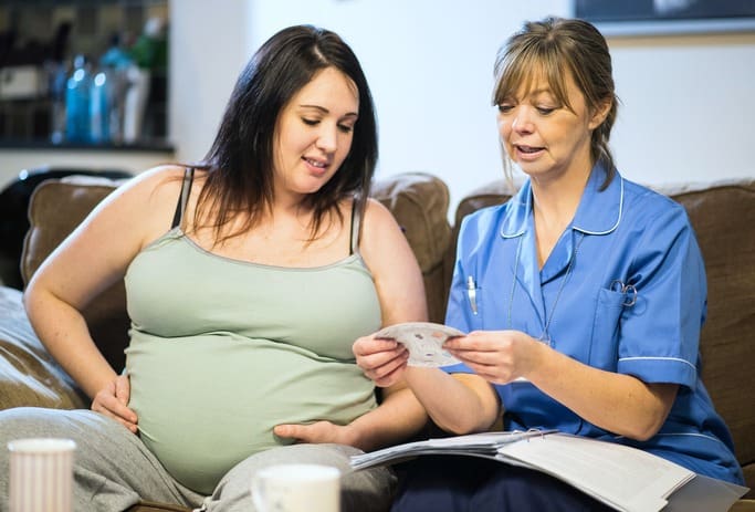 a midwife calculates a pregnant patient's due date
