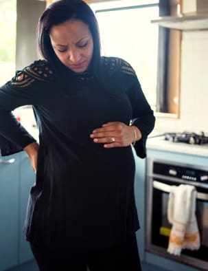 Pregnant woman suffers from back ache