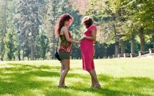 Young women talking together at the park