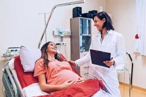 Young woman about to give birth, grateful that she made a birth plan