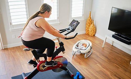 New mom uses exercise bike as baby naps to help with post-baby belly